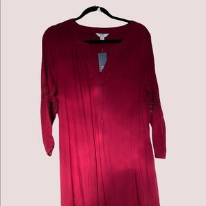 New with tags… very cute. Eyelets in the sleeves